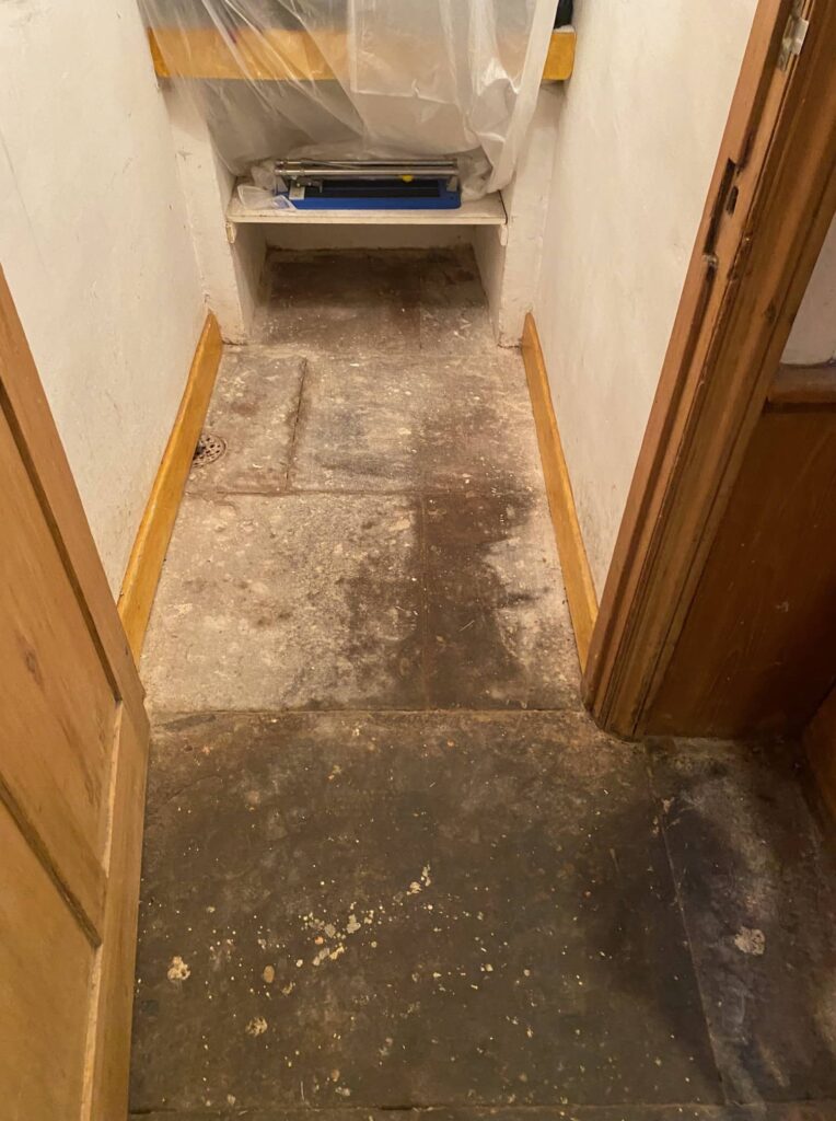 Flood Damaged Red Sandstone Hallway before Cleaning Penrith